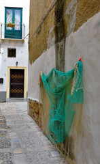 Sticker - fishing nets in the alleys of the historic center of Mazara del Vallo Sicily Italy