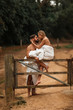 Young beautiful couple in rural area in blankets