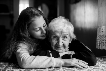 Wall Mural - Little girl with her grandmother has a tender relationship.