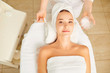© Studio Romantic - Beautiful young woman making mask in a cosmetological clinic.