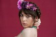 © Pere Chuliá - Young woman dancing with white dress and flowers in her hair. Red background.