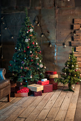 winter home decor. christmas tree in the interior against a wooden wall.