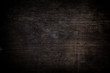 © Egor - Empty dark wood background to insert. space for text.