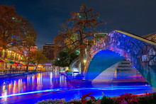 San Antonio River Walk And Stone Bridge Over San Antonio River Near La Villita In Downtown San Antonio, Texas, USA.