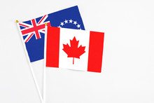 Canada And Cook Islands Stick Flags On White Background. High Quality Fabric, Miniature National Flag. Peaceful Global Concept.White Floor For Copy Space.