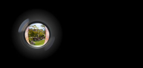 View through peephole in door looking out to entry