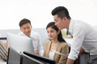 © Blue Jean Images - Chinese business people working in office