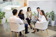 © Blue Jean Images - Chinese business people having a meeting in office