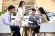 © Blue Jean Images - Chinese business people having a meeting in office