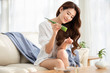 © Blue Jean Images - Young Chinese woman with natural aloe vera at home