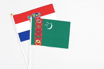 Turkmenistan and Croatia stick flags on white background. High quality fabric, miniature national flag. Peaceful global concept.White floor for copy space.