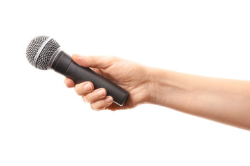 Female hand with microphone on white background