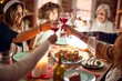 © Krakenimages.com - Beautiful group of women smiling happy and confident. Eating roasted turkey and toasting with cup of wine celebrating christmas at home