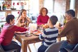 © Krakenimages.com - Beautiful family smiling happy and confident. Eating roasted turkey celebrating christmas at home