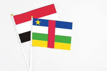 Central African Republic and Egypt stick flags on white background. High quality fabric, miniature national flag. Peaceful global concept.White floor for copy space.