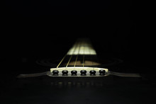 Black Guitar On A Dark Background