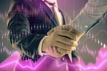 Multi exposure of forex graph on abstract background with two businessmen handshake. Concept of success on stock market