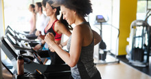 Group Of People Exercising In A Gym Cardio Training And Running