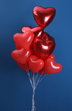 Bunch Of Heart Shaped Balloons On Blue Background. Valentine's Day Celebration
