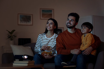 Canvas Print - Family watching movie using video projector at home