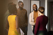 © JonoErasmus - Group of diverse african business people standing and greeting before meeting