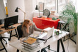 © JustLife - Young tired businesswoman in the office. Beautiful woman sitting in office having headache.