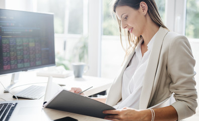 Wall Mural - Businesswoman Working in an Office