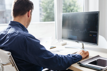 Wall Mural - Businessman Working in an Office