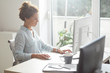 © LStockStudio - Businesswoman Working on a Desktop Computer