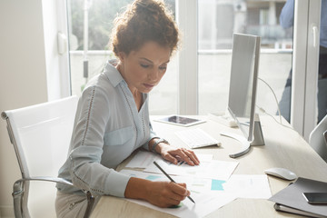 Wall Mural - Businesswoman Working in an Office