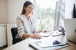 © LStockStudio - Businesswoman Working on a Desktop Computer