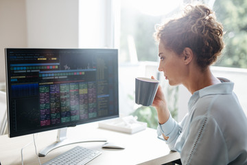 Wall Mural - Businesswoman Working on a Desktop Computer