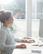 © LStockStudio - Businesswoman Working on a Desktop Computer