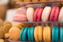 French Macrons Cookies With Sprinkles Yellow Pink Blue White Red On Display Stacked Shallow Depth Of Field Closeup