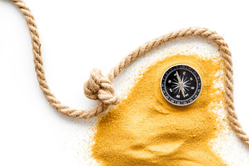 Wall Mural - Goal achievement concept. Compass near rope with knot on white background top view copy space