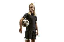 Young Female Soccer Or Football Player With Long Hair In Sportwear And Boots Training On White Background. Concept Of Healthy Lifestyle, Professional Sport, Motion, Movement. Stands With Ball