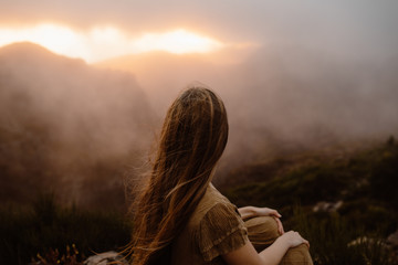 Woman watching sunset