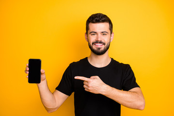 Sticker - Positive cool guy promoter hold cellphone touchscreen point index finger recommend modern technology suggest select black friday wear good looking outfit isolated vivid color background