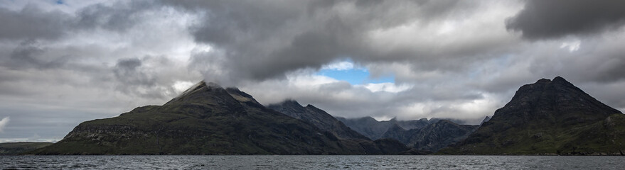 Beautiful mountains landscape of Scotland nature with beautiful evening cloudy sky.