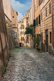 Fototapeta Uliczki - Rome, Italy - October 13, 2019 - one of the many narrow streets of the old Roman district of Trastevere