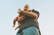 © EVERST - Father holding infant baby family lifestyle dad and child walking together parenthood childhood concept Fathers day holiday bottom view