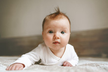Cute Baby Infant Crawling In Bedroom Adorable Kid Portrait Family Lifestyle 3 Month Old Child Close-up