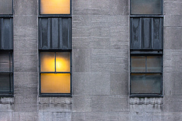 Wall Mural - warmly lit window on urban building