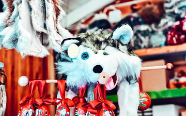 Poster - Market stall with traditional souvenirs such as husky dog toy in winter Rovaniemi, Lapland, in Finland. Street Xmas holiday fair. Advent Decoration and Stalls with Crafts Items on Bazaar