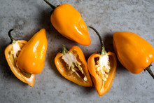 Whole And Halved Habanero Peppers