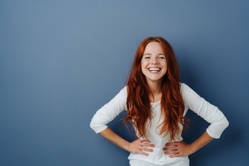 Wall Mural - Young woman having a good giggle