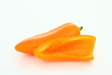 Wall Mural - Sliced orange sweet pepper on white background - cross-section - fresh food