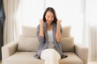 © siraphol - Portrait beautiful young asian women happy smile relax sitting on sofa chair