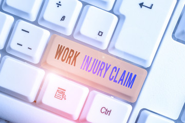 Text sign showing Work Injury Claim. Business photo text Medical care reimbursement Employee compensation White pc keyboard with empty note paper above white background key copy space