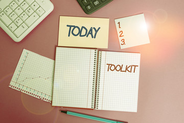 Text sign showing Toolkit. Business photo showcasing set of tools kept in a bag or box and used for a particular purpose Writing equipments and computer stuffs placed above classic wooden table